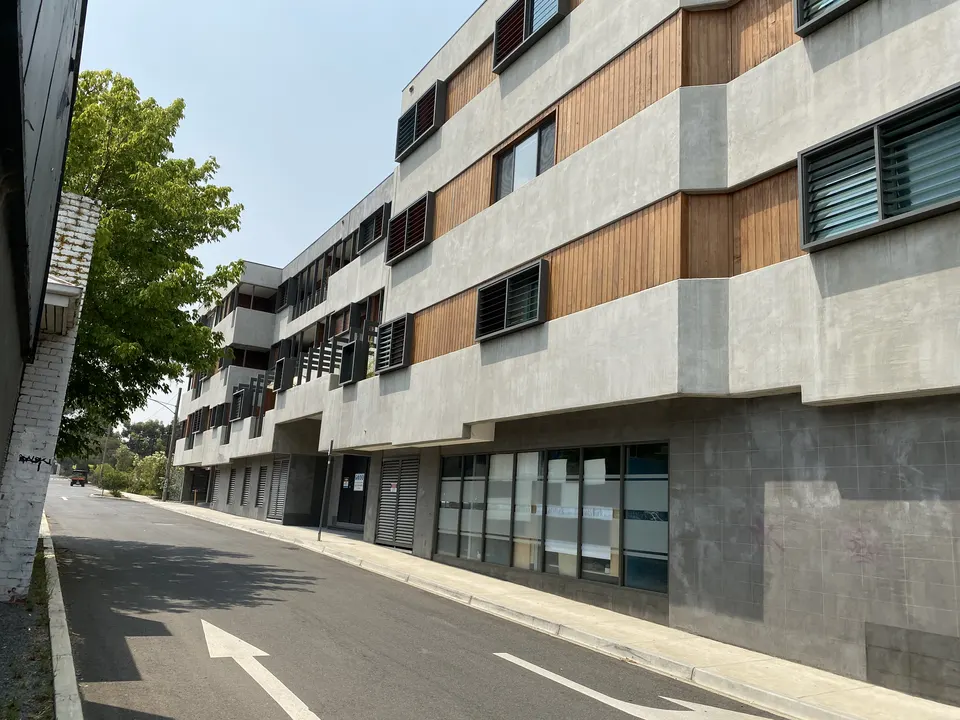Modern apartment building with timber and concrete facade in Melbourne